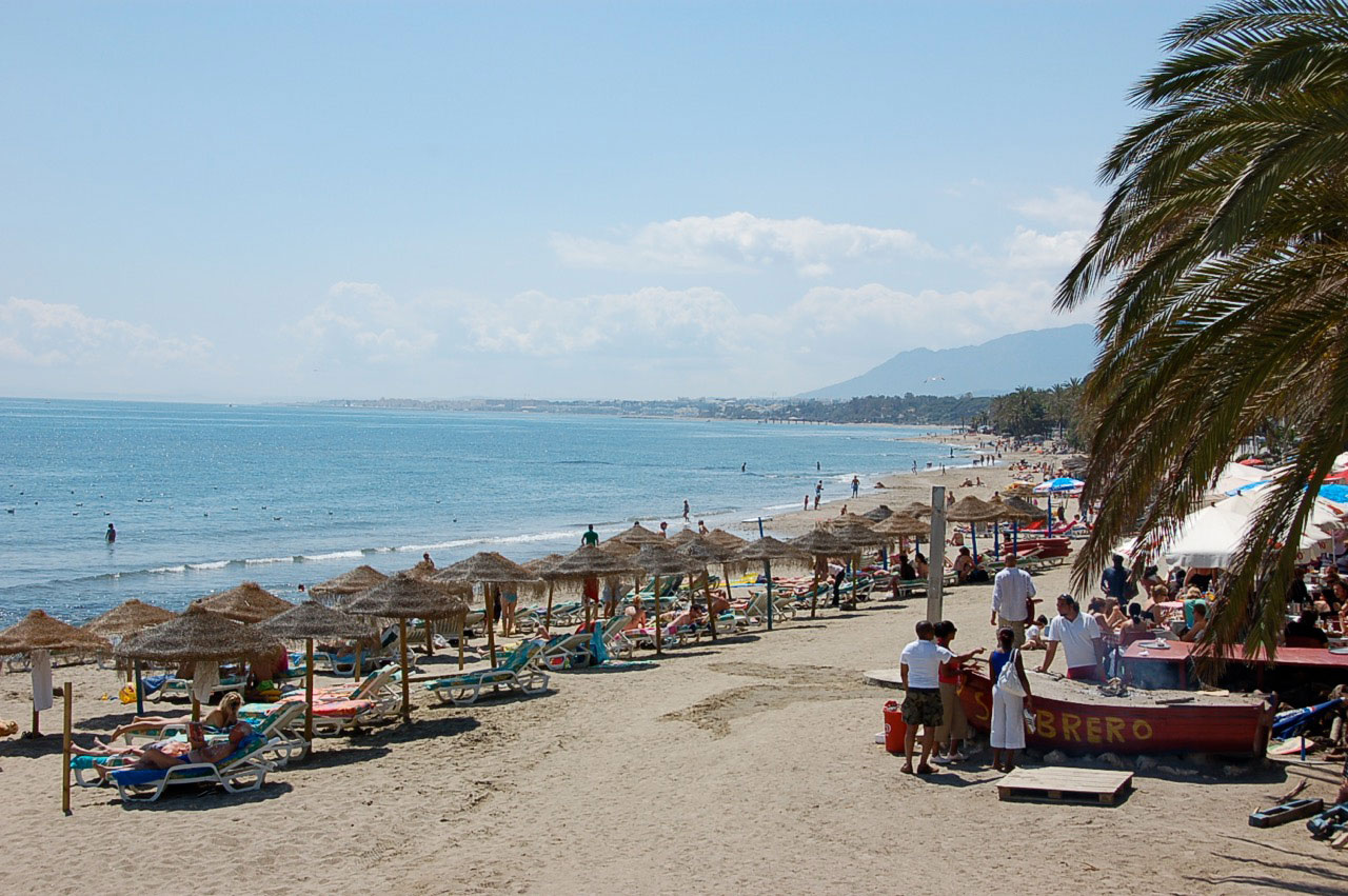 Marbella sandy beach and sun-loungers